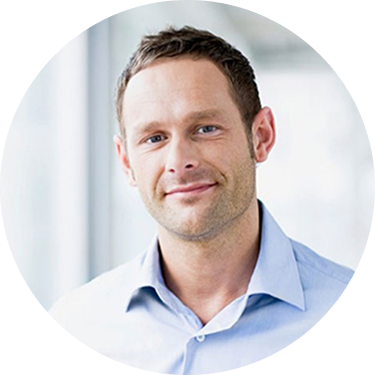 A smiling woman with short brown hair